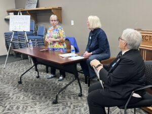 Panel: Blue Strategies for Running in Red States. Iowa House Representative Sue Cahill (left) and  longtime campaign manager Julie Stauch (middle) gave empowering advice for rural campaigns, including the effectiveness of person-to-person postcards and other helpful tips. Mary Weaver, Women’s Caucus Chair Mary Weaver (right) moderated.