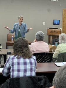 Stump Speech by District 2 Congressional Candidate. Sarah Corkery gave a real-time example of a stump speech. Hers centered around the personal experiences that motivated her to action and led her to run for US Congress.